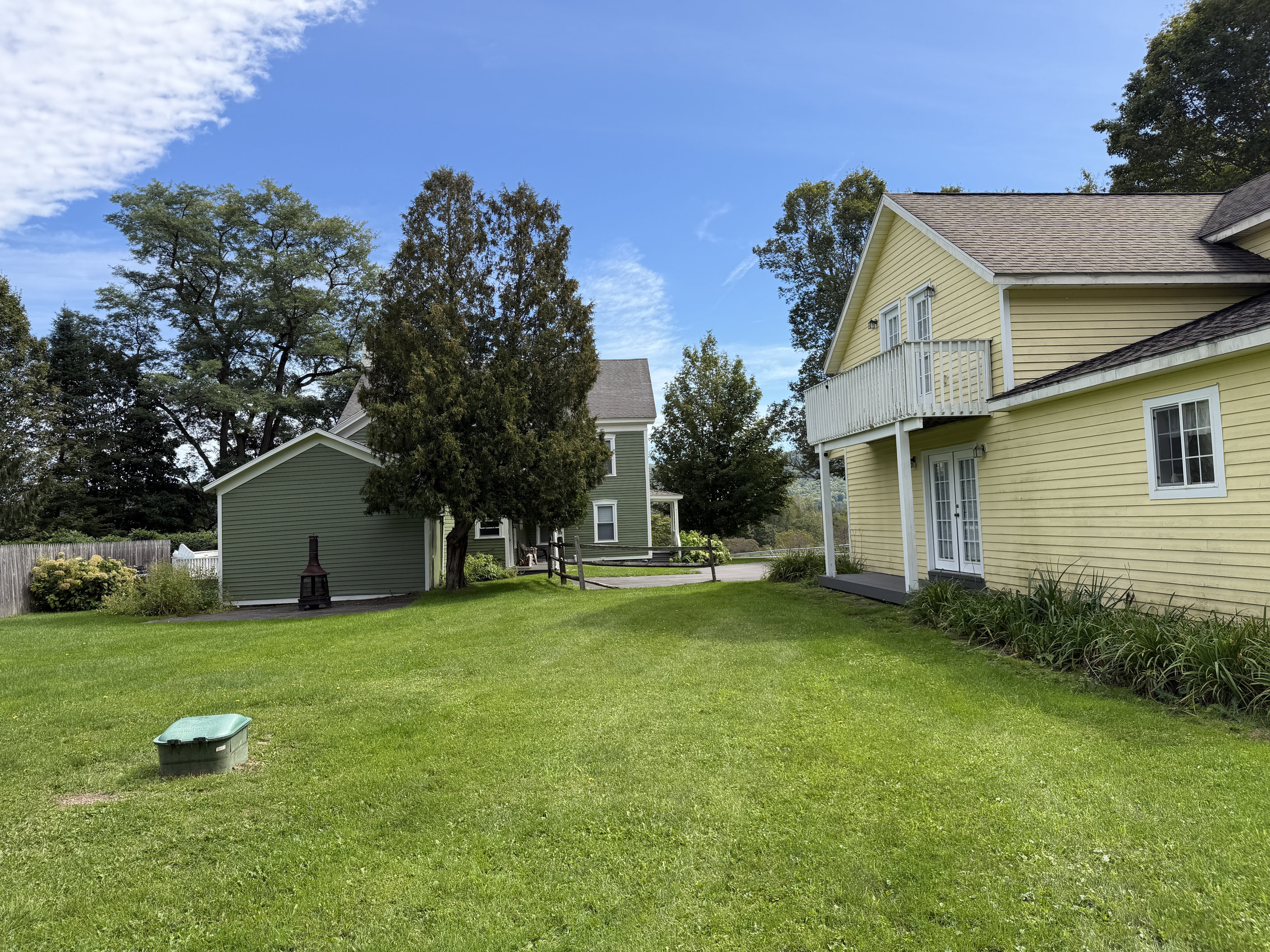 View from the large yard looking back at the Main house (left) and the apartments(right).