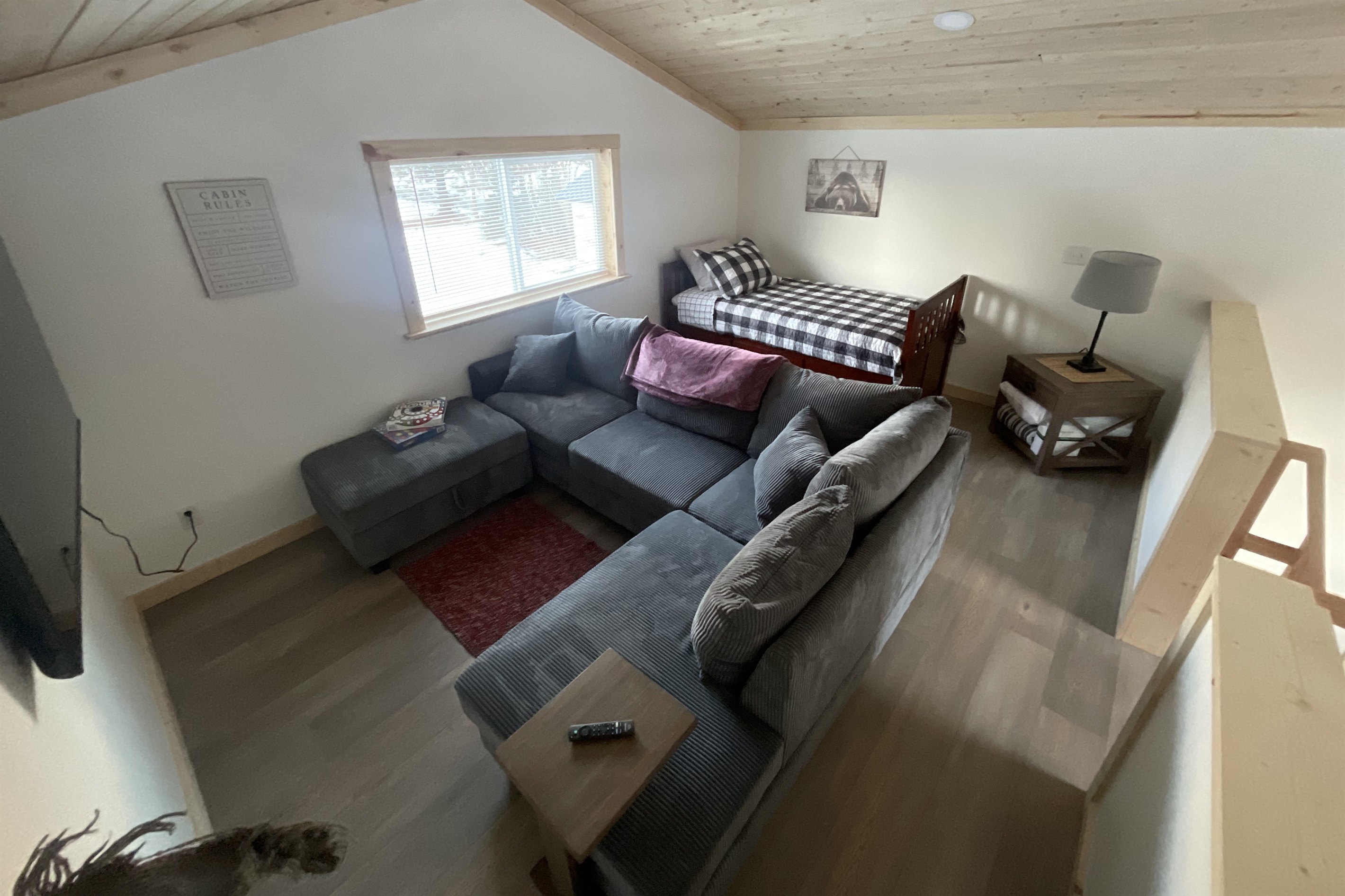 Loft area includes section sofa and additional bed (twin bed with trundle bed)