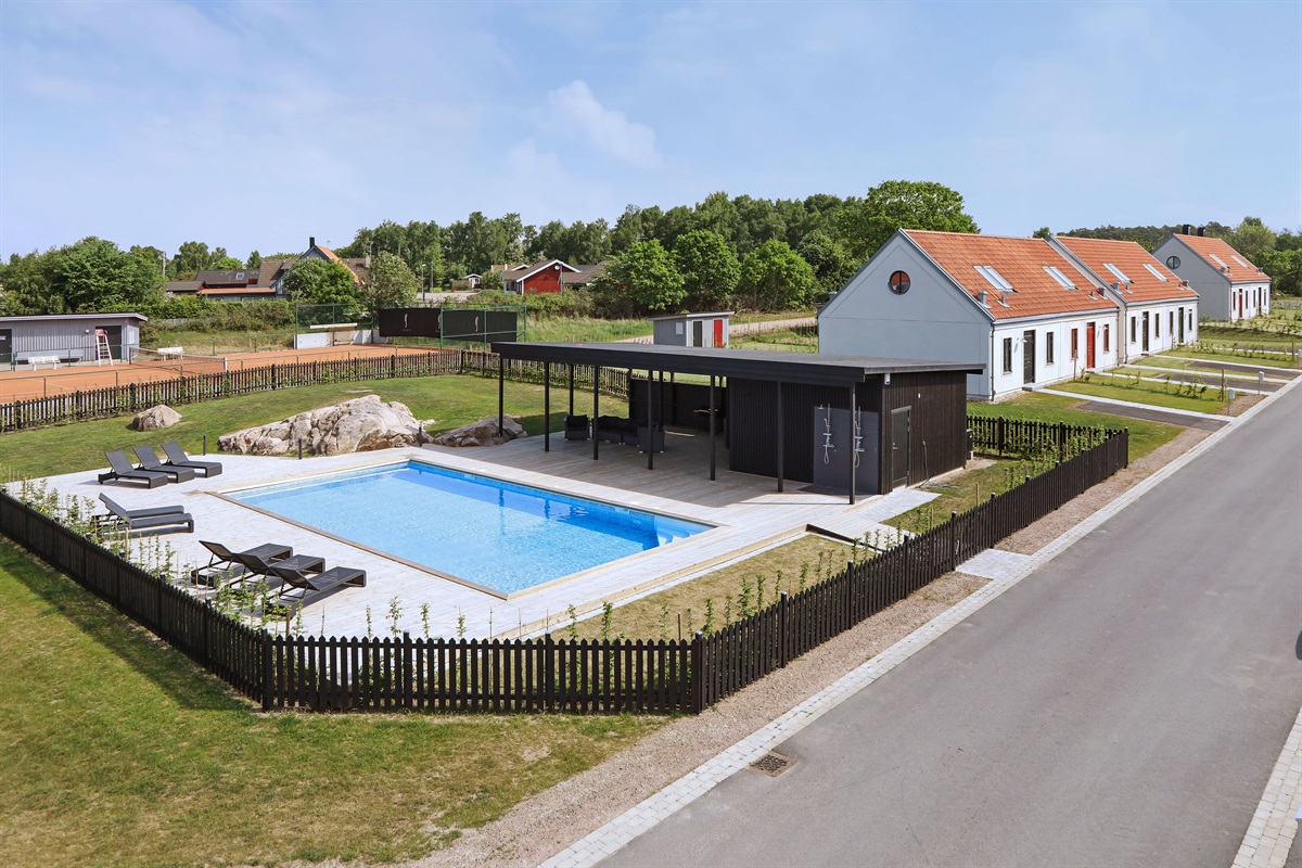 Heated pool and pool area with outdoor showers.