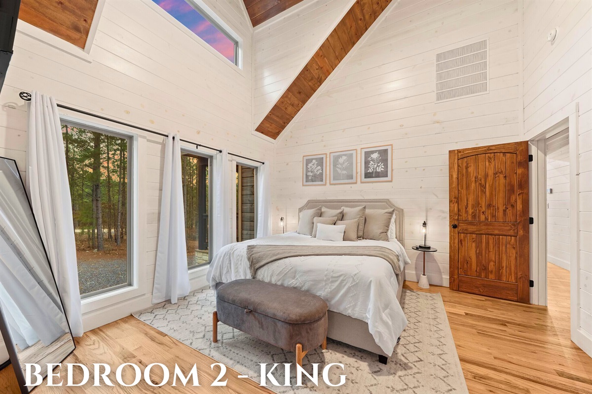 Bedroom 2 featuring a king bed and peaceful decor.