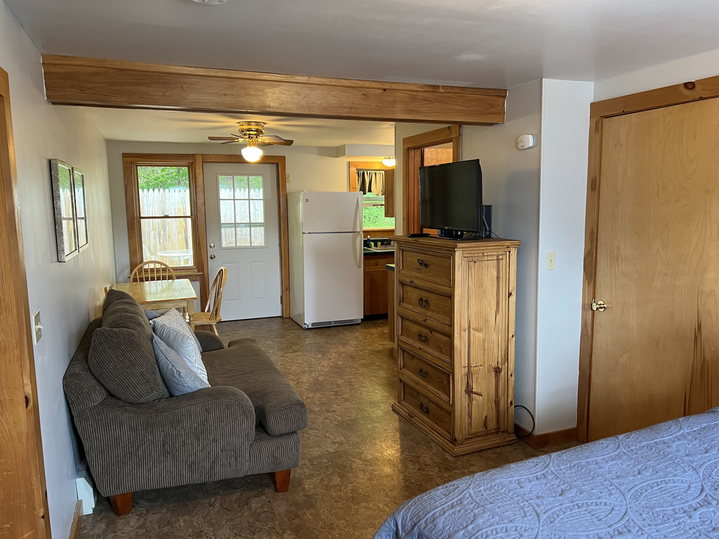 The main area also includes the kitchen and table for 3. There is a door leading to a private enclosed balcony.
