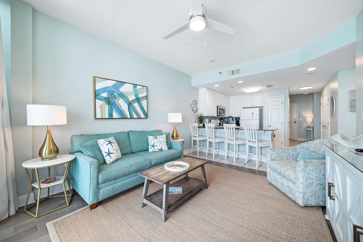 Open-concept living area and spacious kitchen bar with seating for four is the perfect spot for casual meals, morning coffee, or gathering with friends. It's the ideal space to socialize while keeping the chef company.
