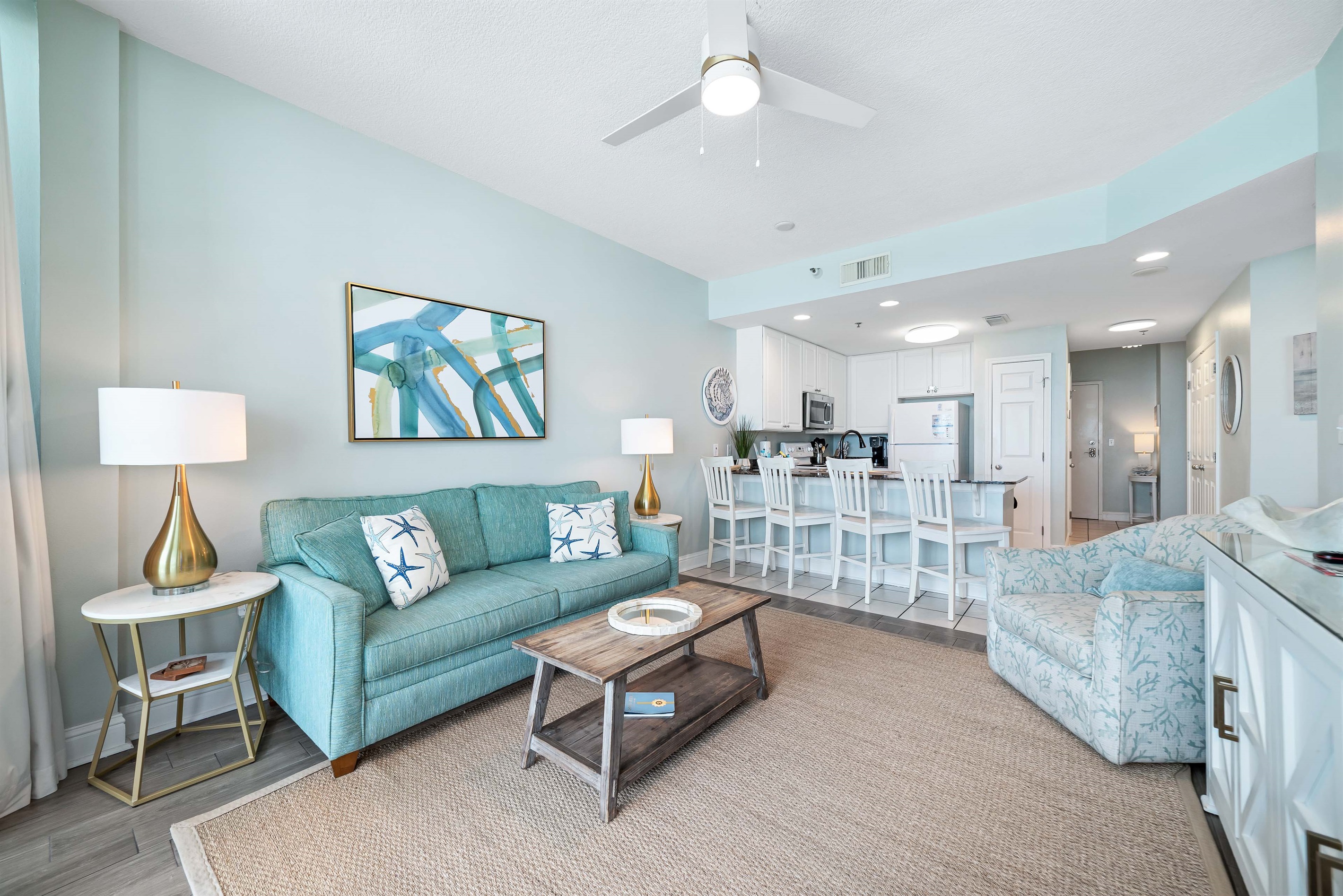 Open-concept living area and spacious kitchen bar with seating for four is the perfect spot for casual meals, morning coffee, or gathering with friends. It's the ideal space to socialize while keeping the chef company.