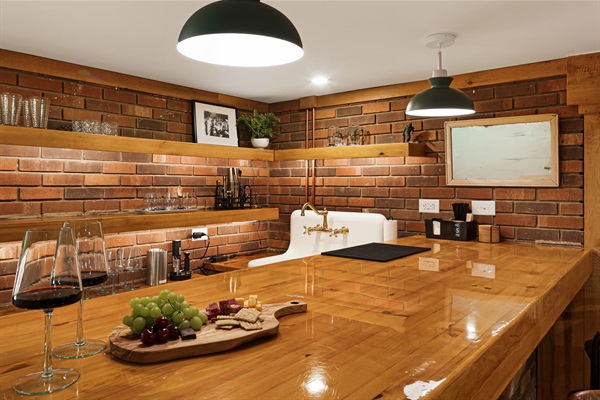 The bar areas was also redone and restored for modern days. It has all the essentials for entertaining, including a small fridge, blender, different types of glassware and a vintage cast iron sink for quick dish clean up. 