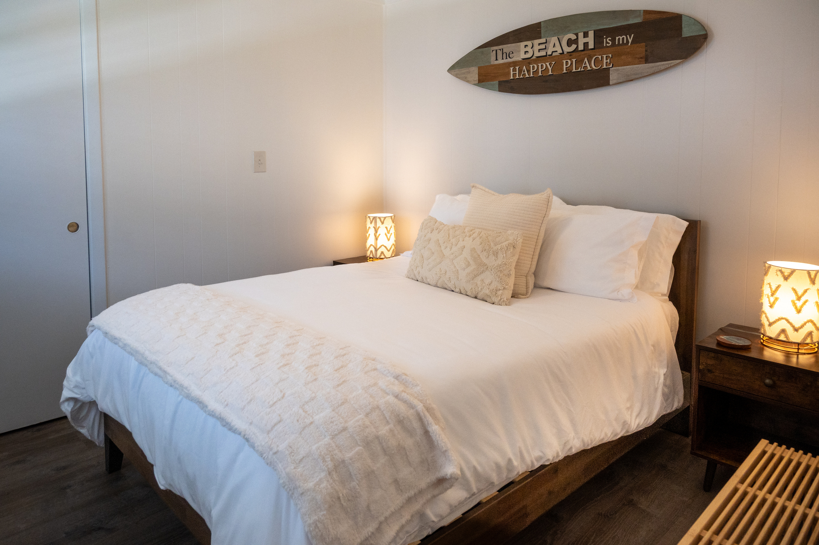 Private bedroom with a plush queen bed – the beach is your happy place