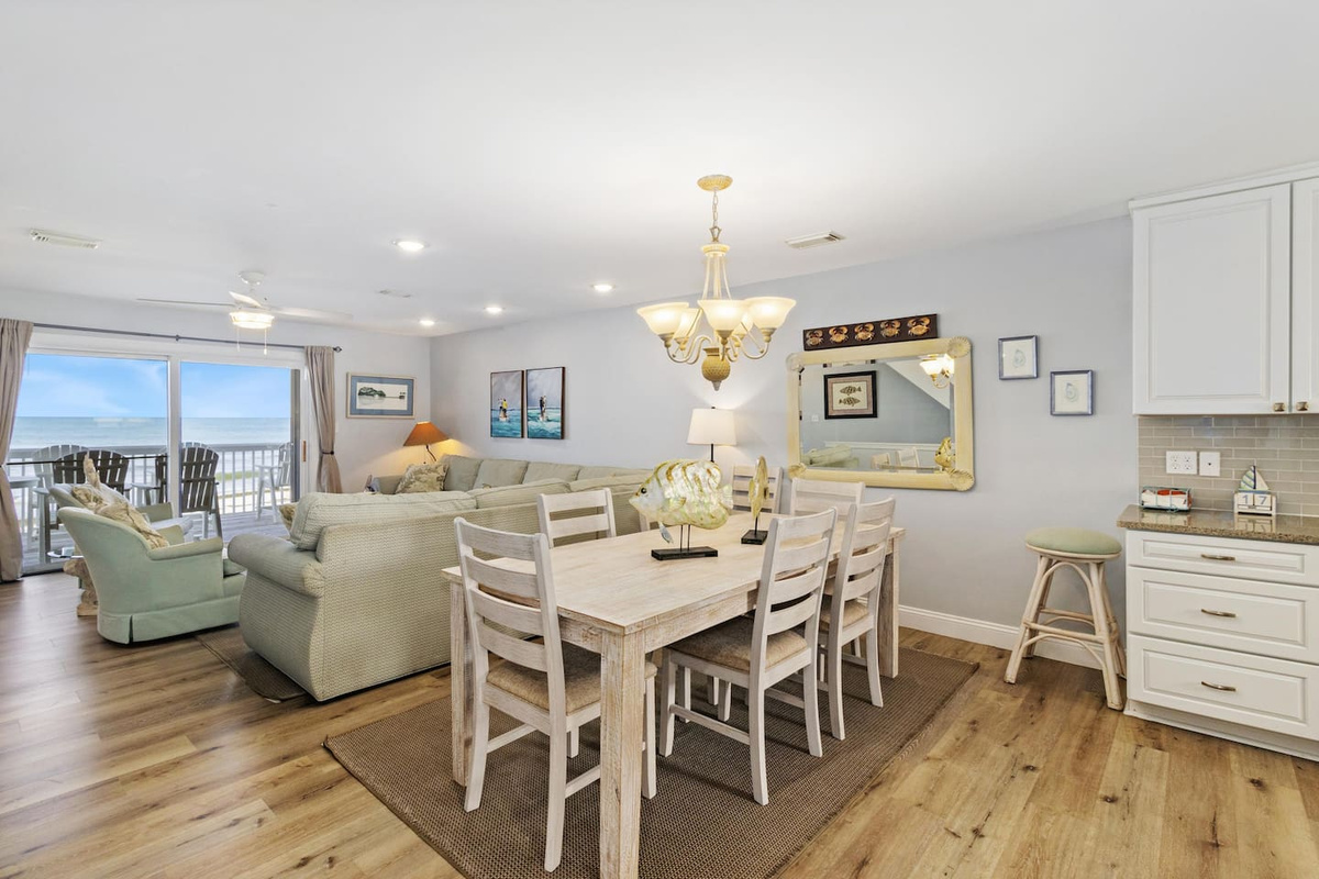 Gather the whole group on the main level &mdash; the open layout flows from kitchen to dining to living without a wall in sight.