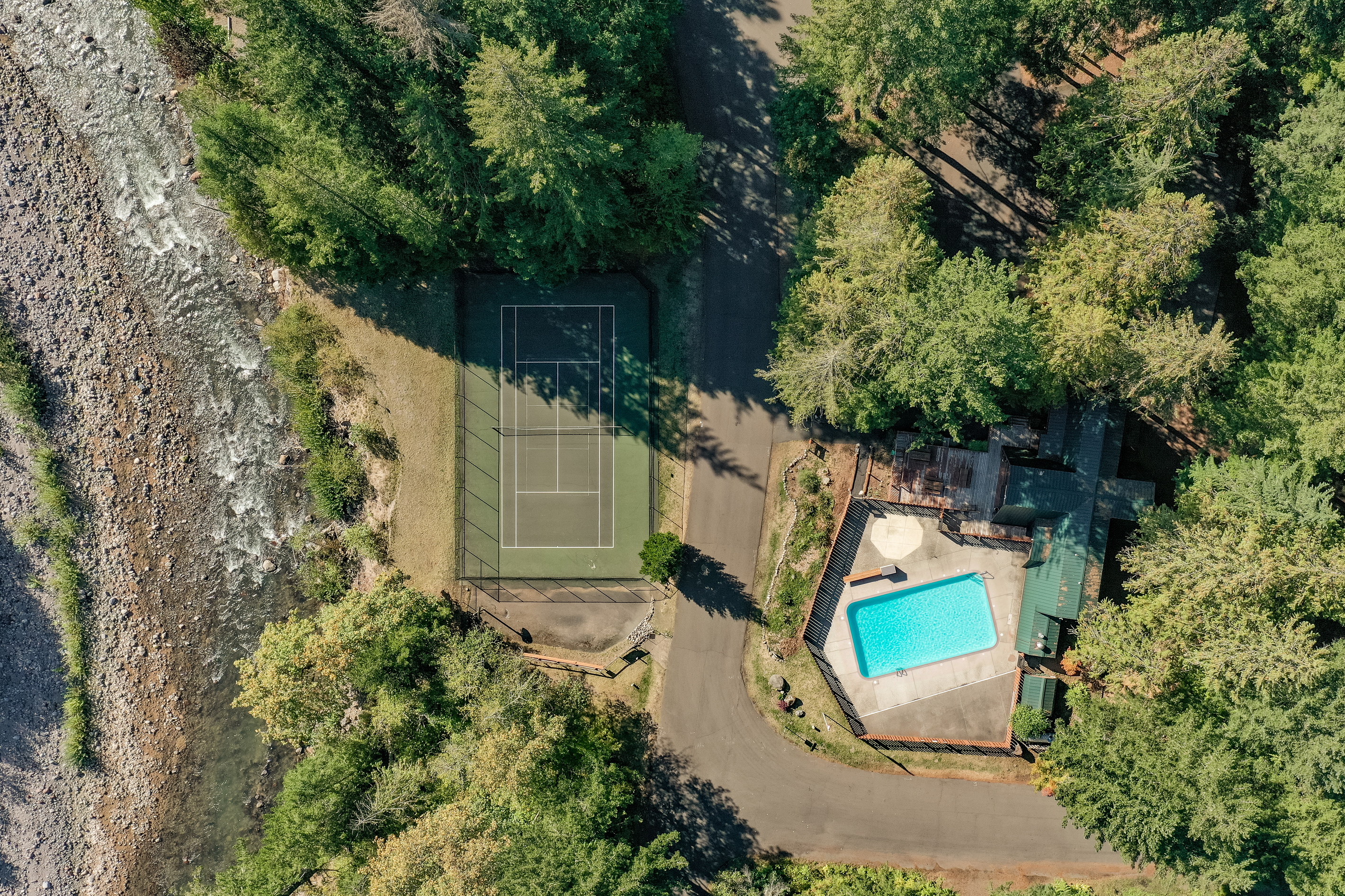 Community perks nearby: a shared pool, tennis court, and riverside views, all an easy walk from home.