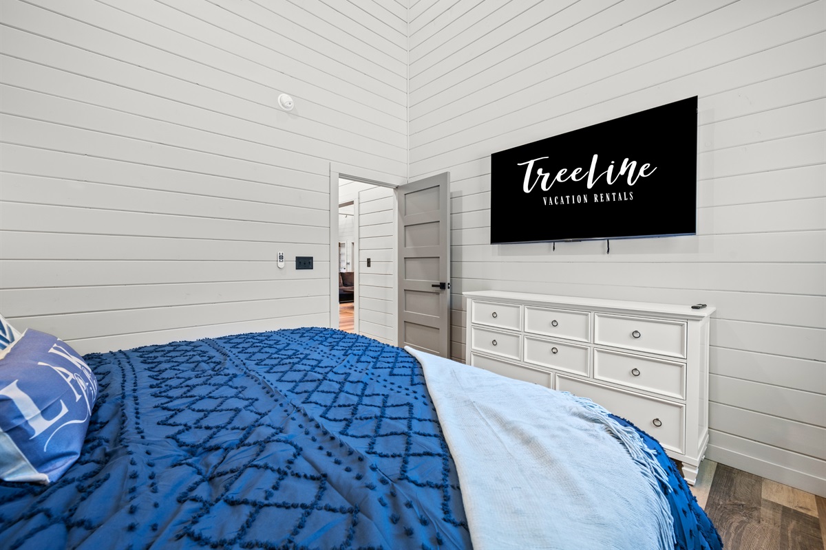 Cozy and inviting, this bedroom offers plenty of natural light and a peaceful spot to unwind before bedtime.