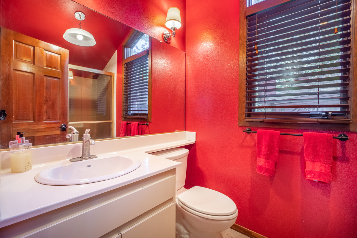 Cheerful main floor bathroom with shower.