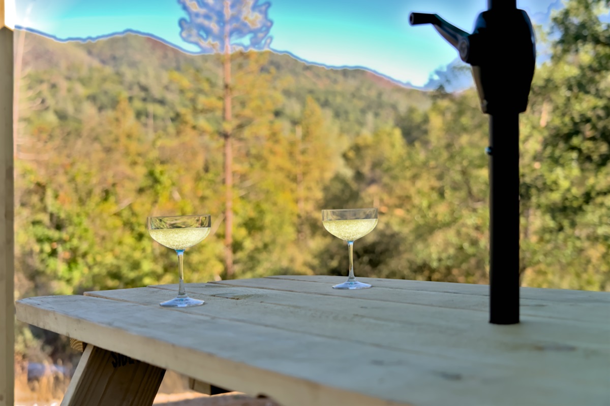 Sipping wine outdoors while enjoying the view of the Sierra Mountains can be a truly serene and enjoyable experience.