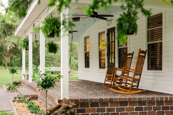Front porch mornings - rocking chairs, hanging ferns, and birdsong.