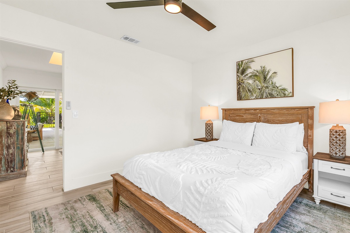 Bedroom 2 offers a relaxing coastal vibe with crisp linens, warm natural light and elegant decor- perfect for guests seeking comfort and tranquility after a day in paradise