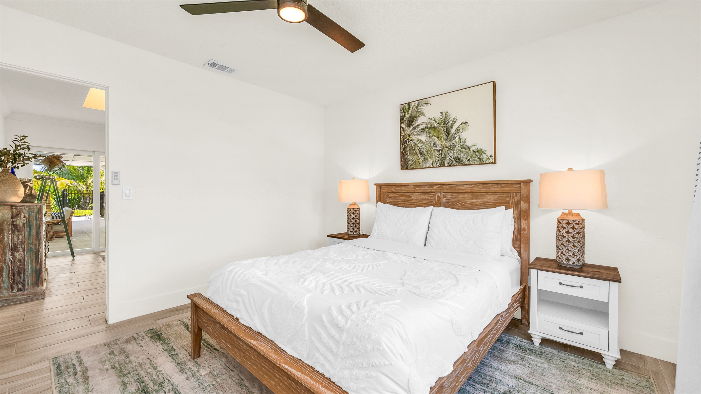 Bedroom 2 offers a relaxing coastal vibe with crisp linens, warm natural light and elegant decor- perfect for guests seeking comfort and tranquility after a day in paradise