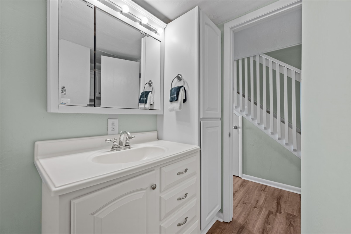 Second bathroom with ample storage and easy access from common areas