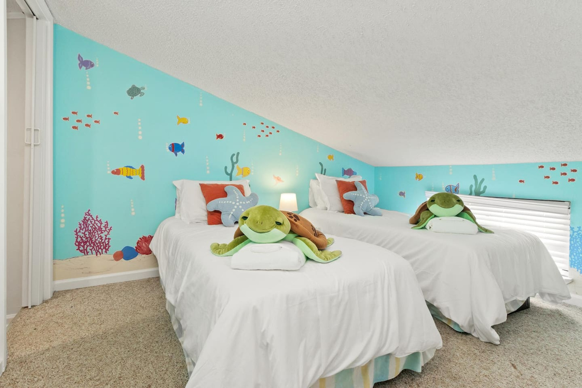 Claim the loft &mdash; kids win every time with two twins, charming d&eacute;cor, and their own cozy TV zone.