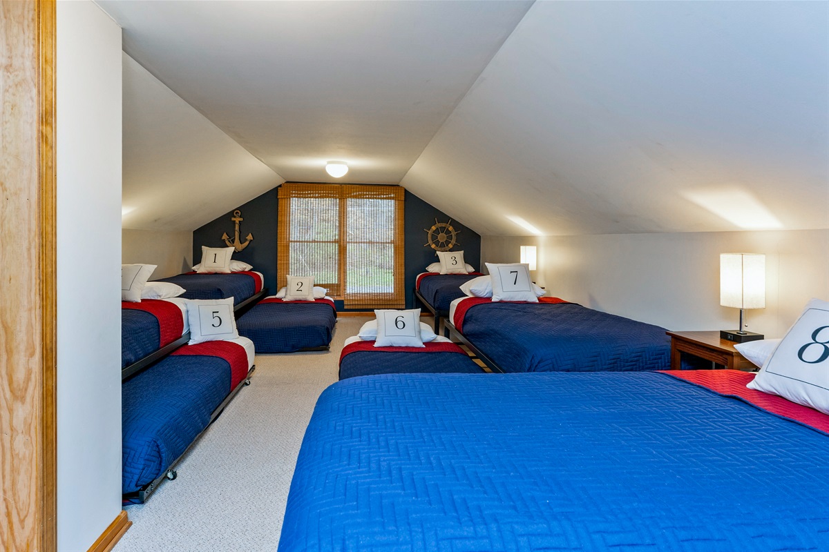 Upstairs bunk room with 8 twin beds