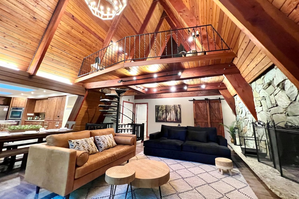 View of living room, loft and kitchen