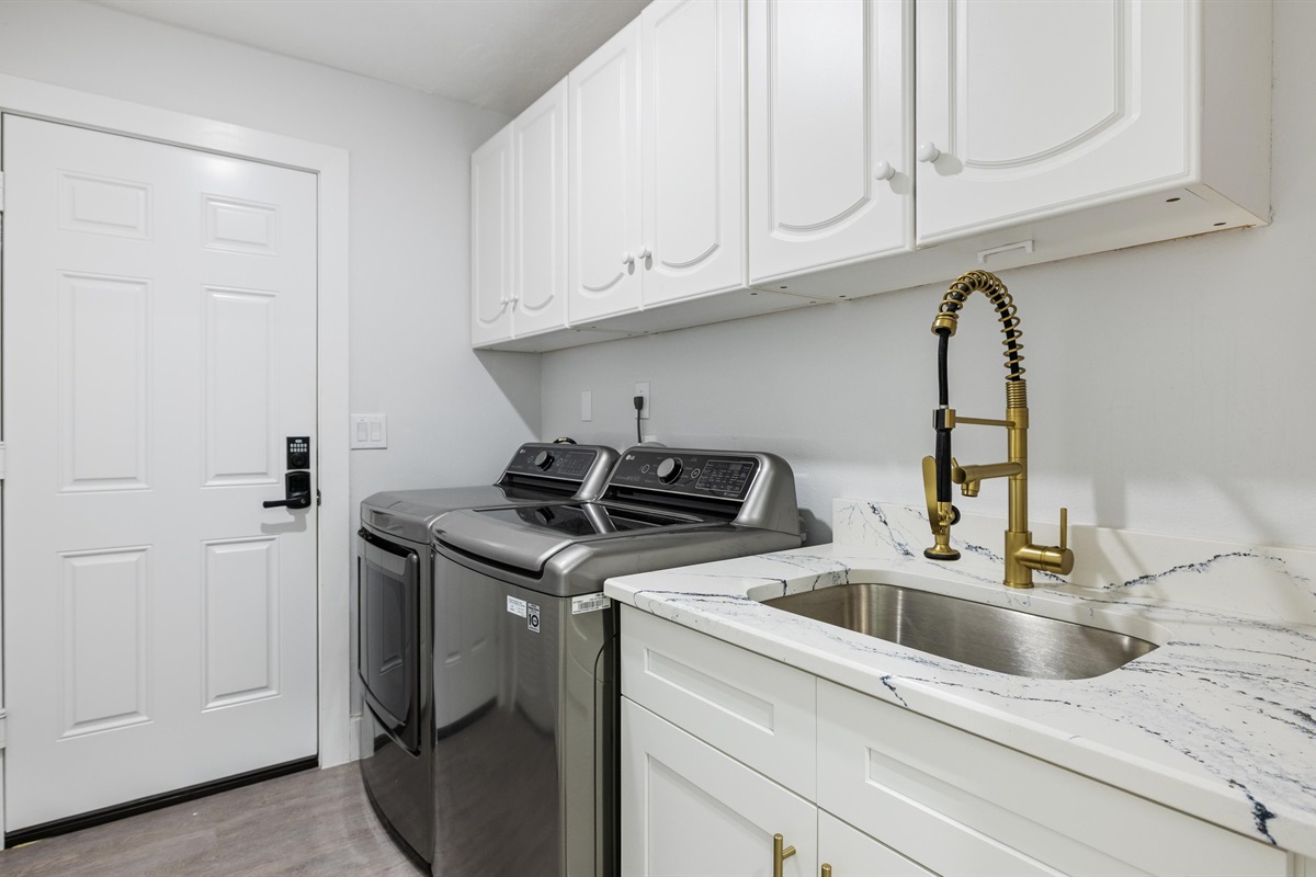 Free to use the washer and dryer units with a sink beside; provided beach/bath towels, detergent & softener.