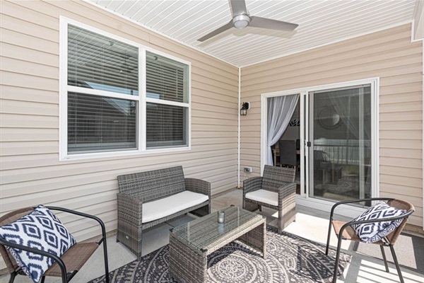 Step into our connected screened-in porch, an extension of the dining room! Seating for seven invites you to dine alfresco or relax. A ceiling fan keeps it cool and breezy, making every meal or moment enjoyable in this charming space. ️
