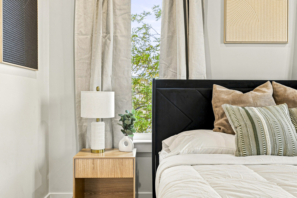 Stylish decor, abundant natural light, and a peaceful garden view await you!