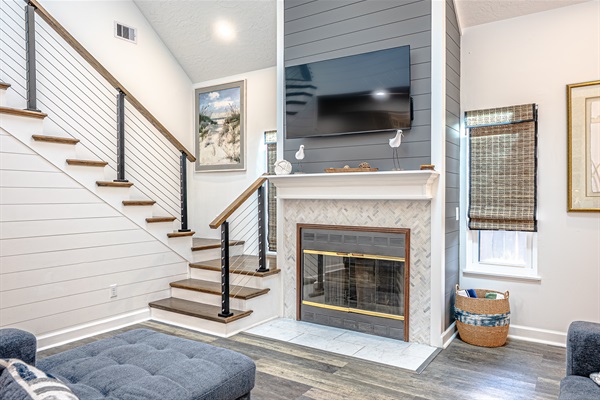 Living room with stairs to Loft Bedroom