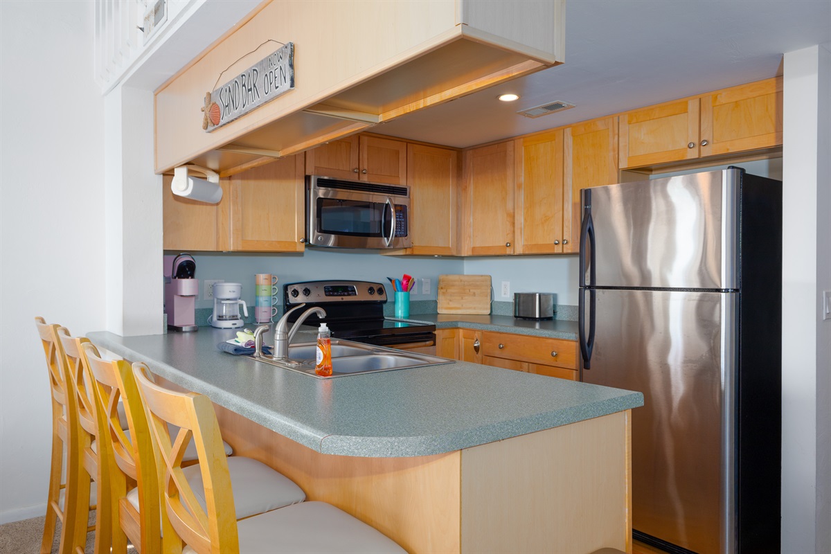 Kitchen island with ample counter space and bar stools