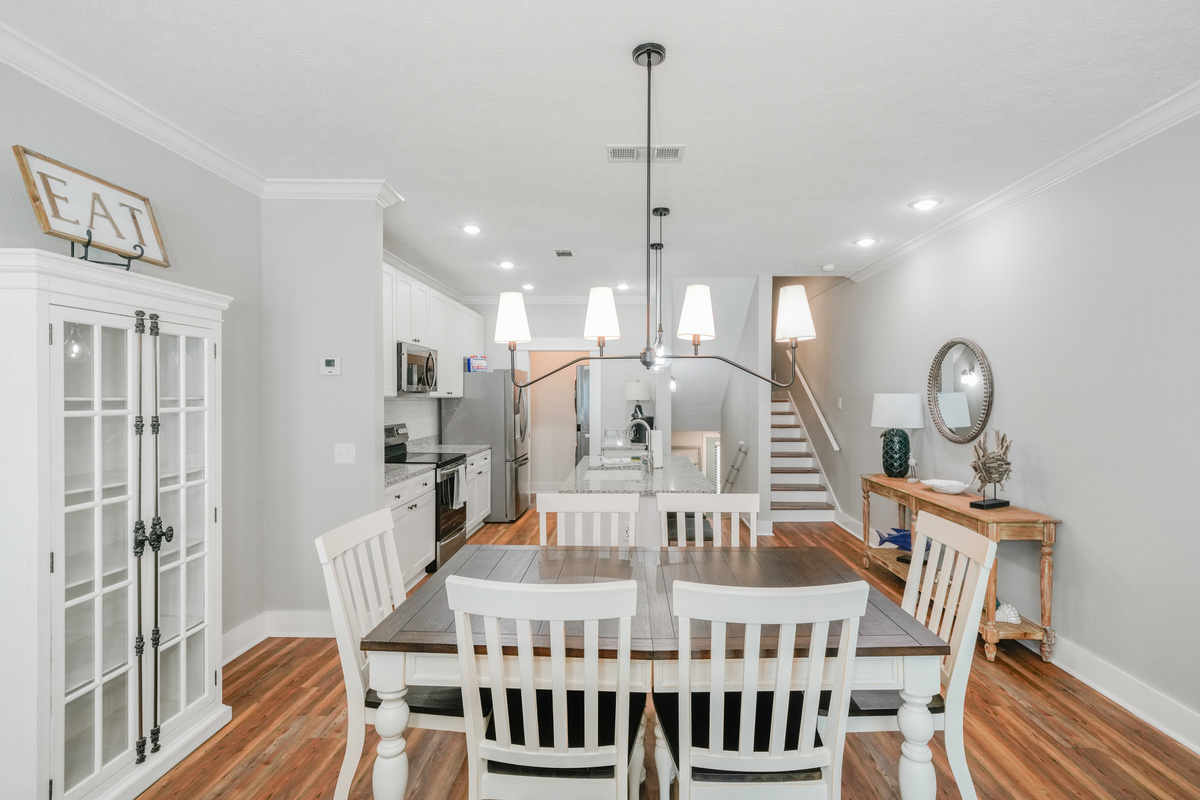 Spacious dining area connected to a fully equipped open kitchen, making family meals and entertaining a breeze