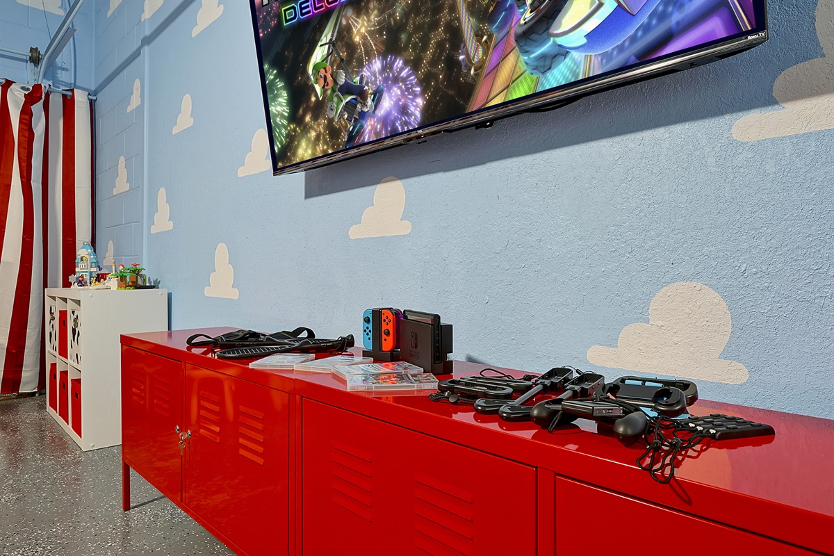 Nintendo Switch, games, and accessories are one way to enjoy the huge 65&rdquo; Roku TV in the game room.