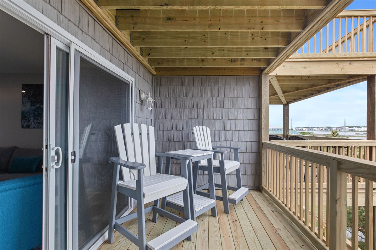 Cozy covered balcony seating&mdash;perfect for morning coffee or evening drinks
