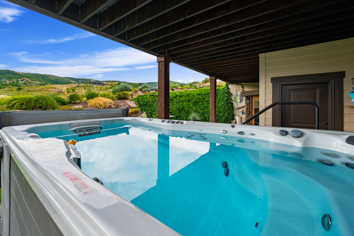 Stretch out and relax in the oversized private swim spa, perfect for year-round enjoyment beneath the covered patio.