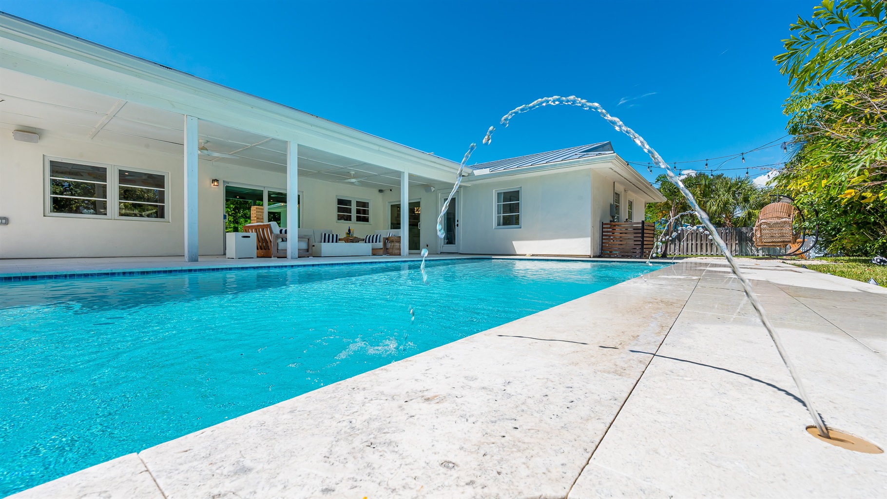 Heated saltwater pool with deck jets and color-changing LED lights. Perfect spot to soak up the sunshine and take a dip any time of day.