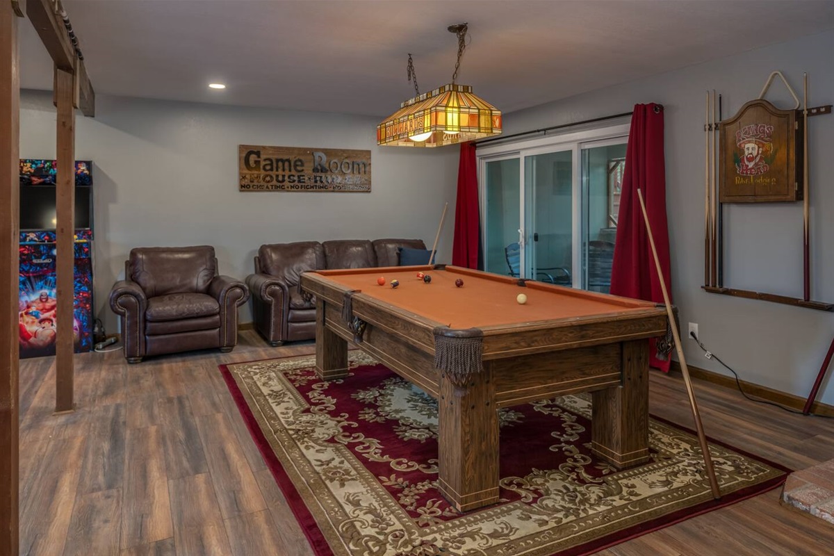 Game Room with pool table, arcade with 6k+ games, and comfortable seating.