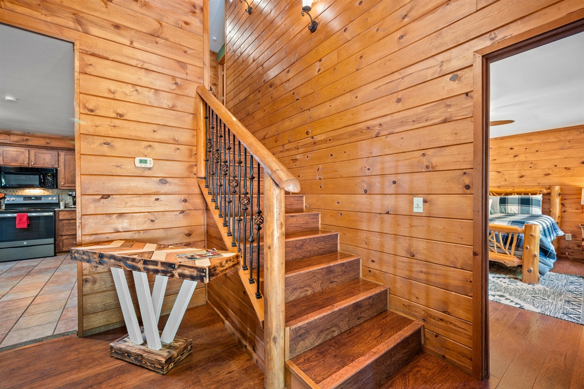 Leads directly from the open-concept living space to the upper loft and sleeping areas.