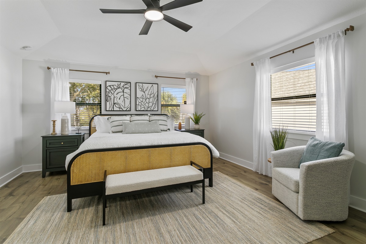 Primary suite with plush bedding, natural light, and calming design touches
