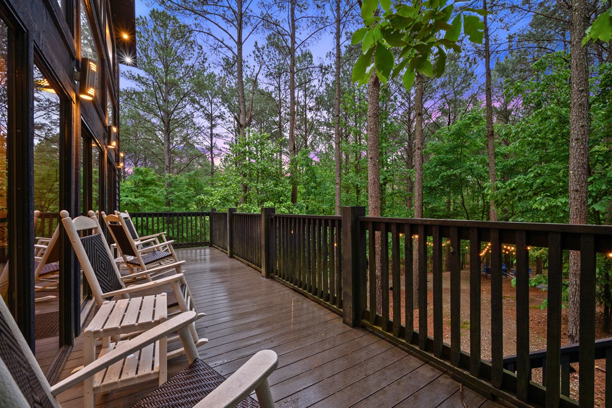 Rocking chairs along the porch invite you to slow down and take in the calm surroundings at your own pace.