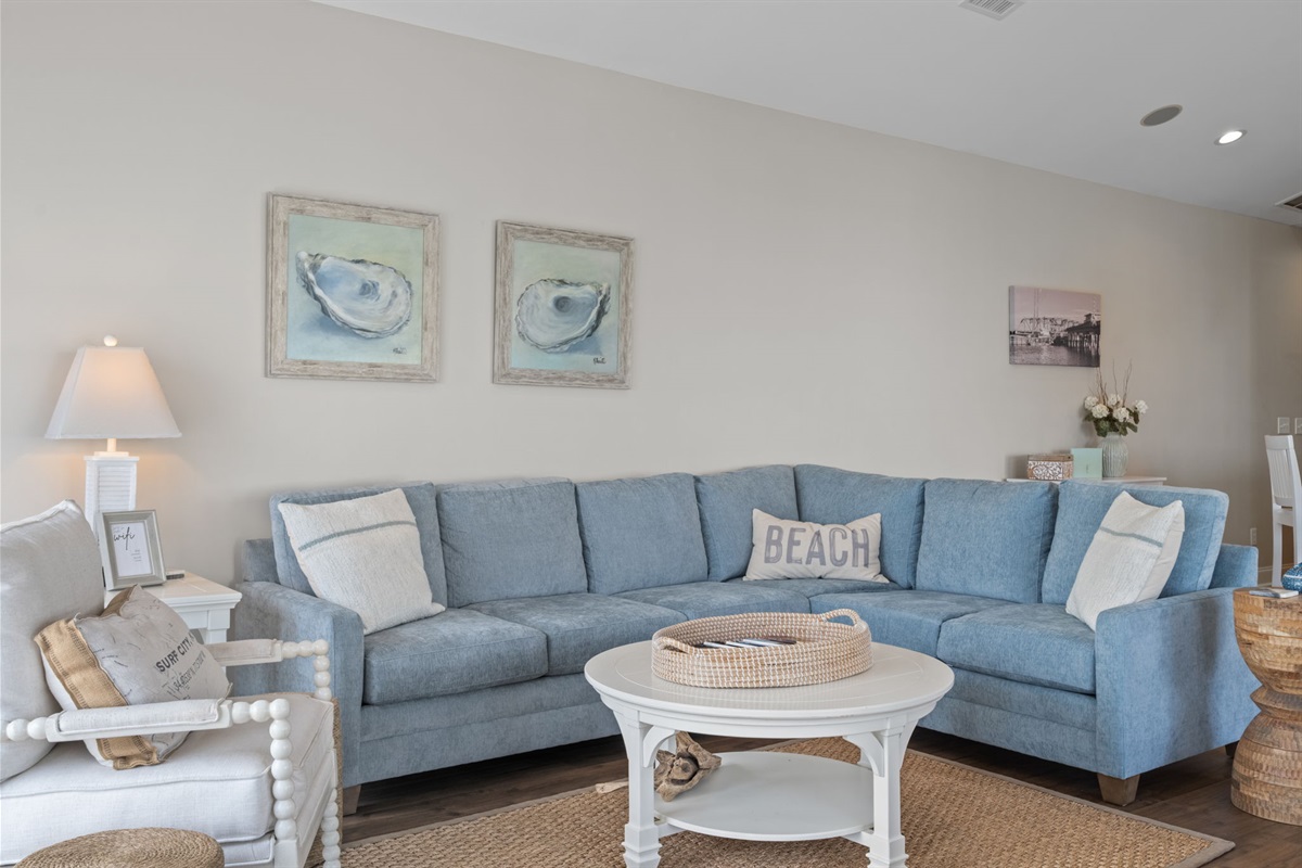 Coastal charm meets comfort featuring a brand new couch