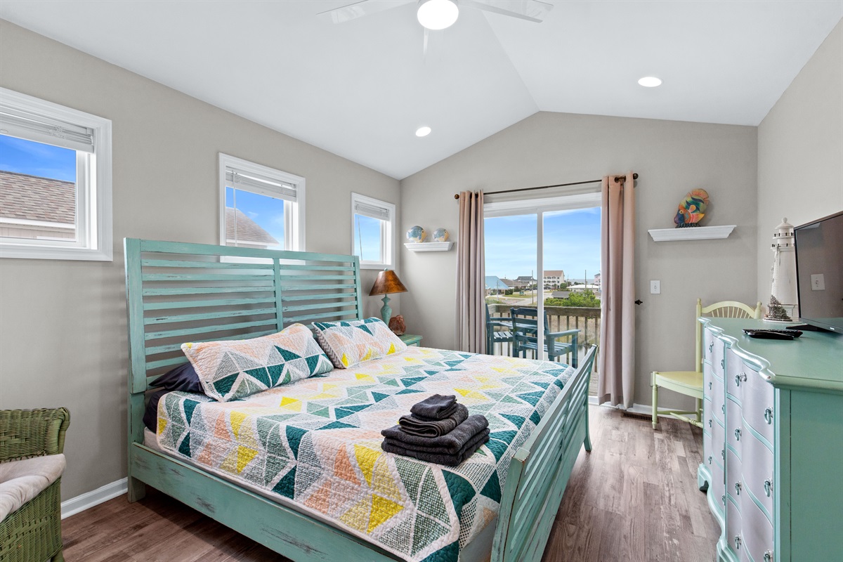 Bright, inviting bedroom with comfortable king bed and thoughtful touches