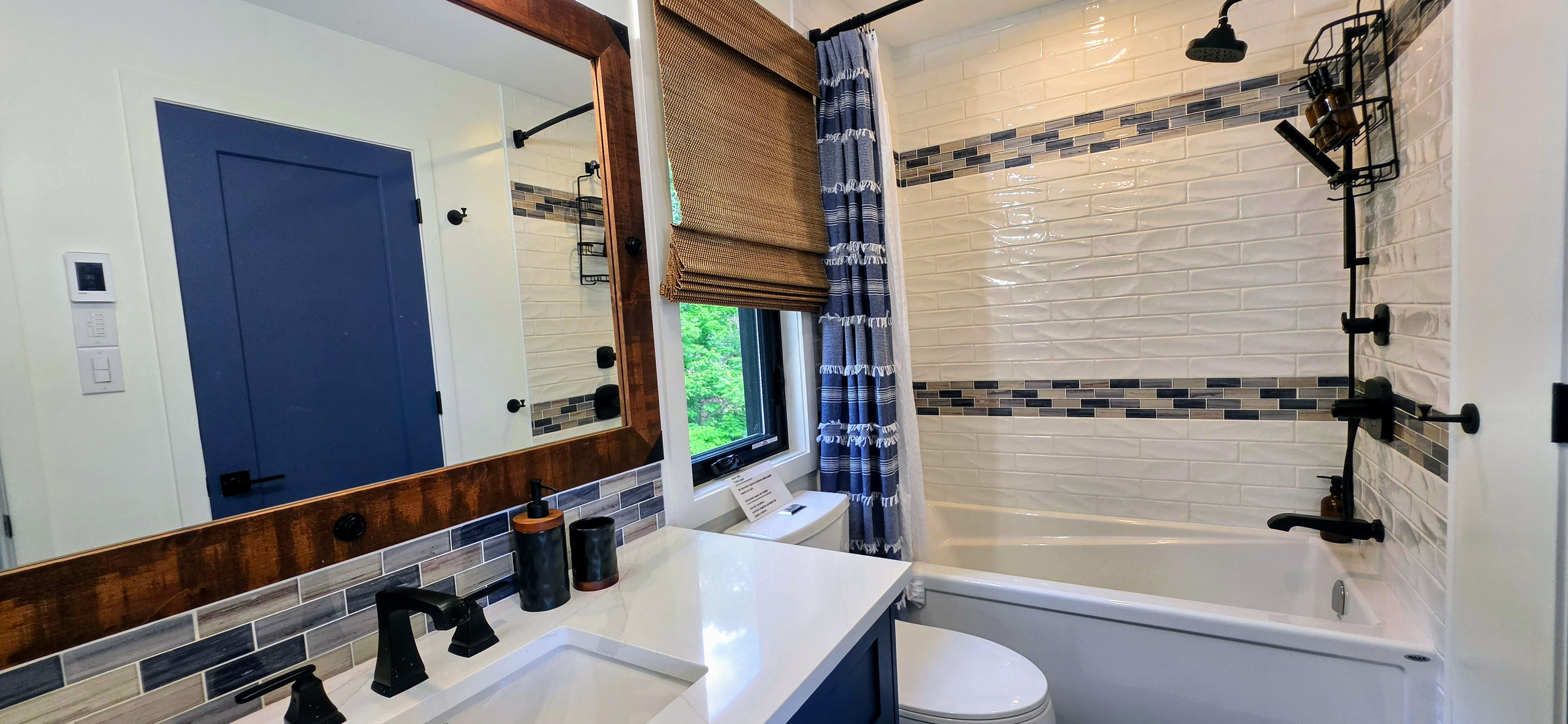 Main floor full bathroom with tub and shower