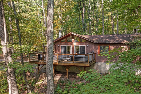 Unwind in the hot tub or take in the view from the deck — serene woods surround this charming Berkeley Springs chalet