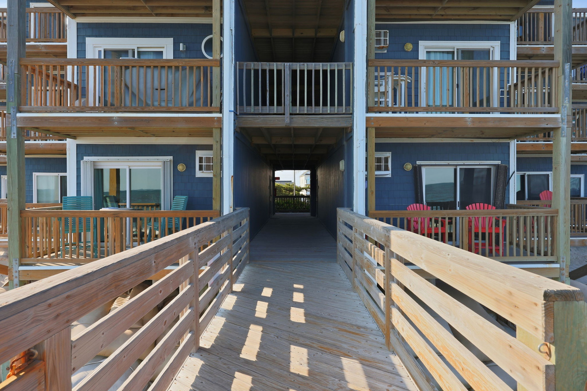 A convenient walkway leads guests toward the ocean, creating a relaxing arrival experience just steps from the shore