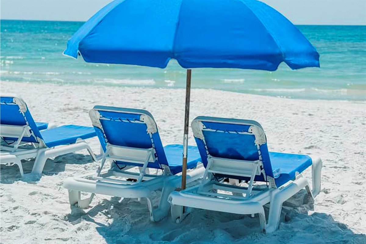 2 Chaise Lounges and a Beach Umbrella Set Up Just for You During Your Stay March–October