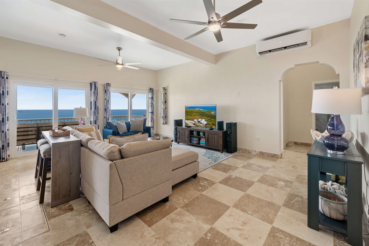 A cozy spot to watch TV or read a book with endless ocean sights.