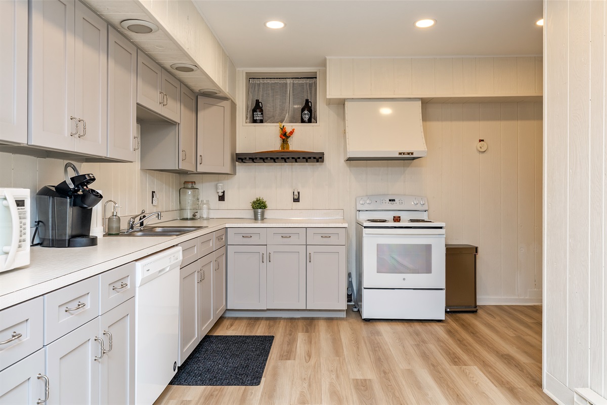 Whip up meals with ease in the spacious, full basement kitchen featuring modern appliances and plenty of counter space.