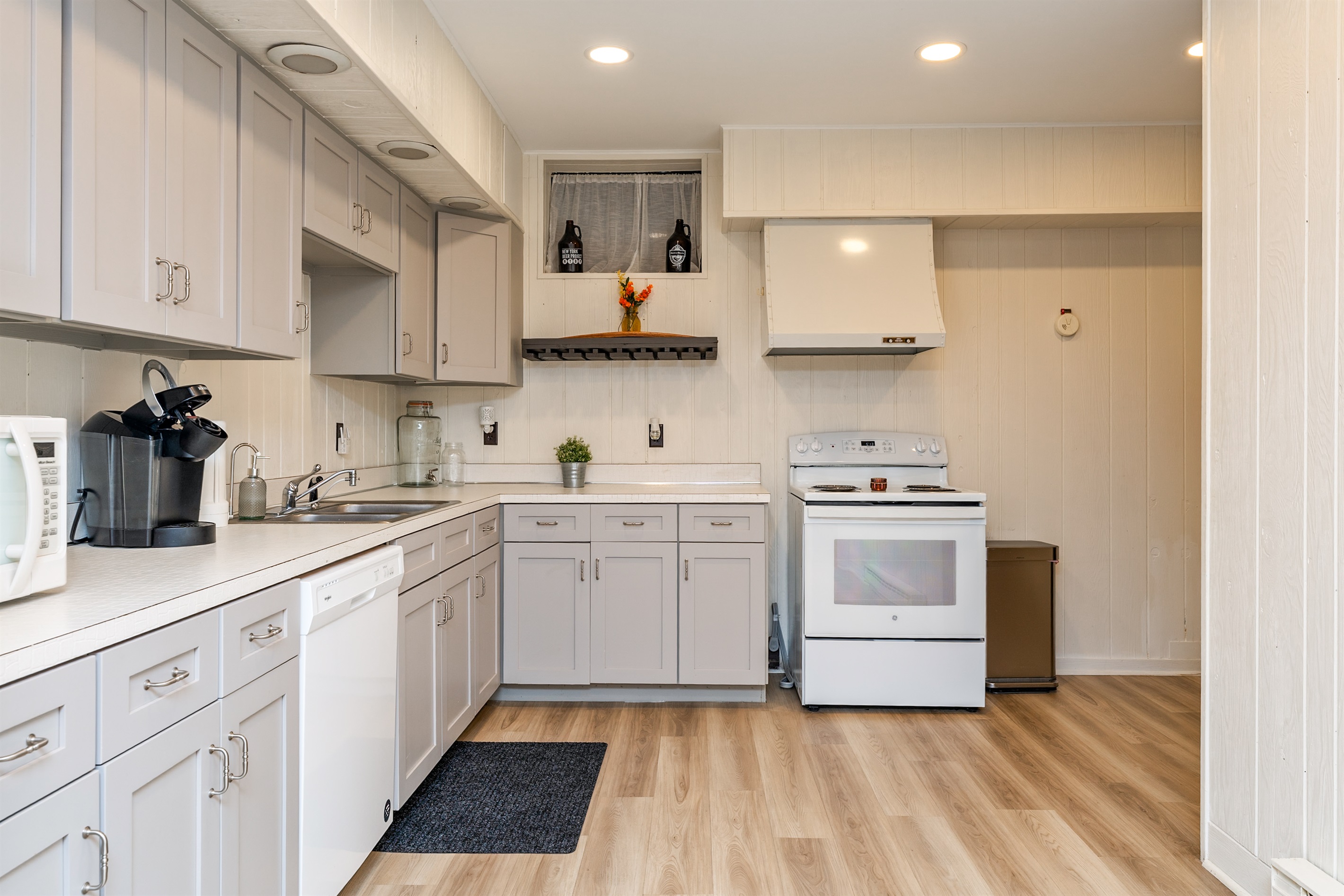 Whip up meals with ease in the spacious, full basement kitchen featuring modern appliances and plenty of counter space.