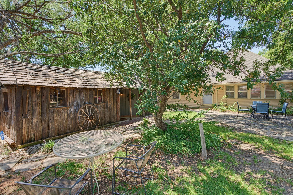 This is a separate building with a private entrance and covered parking off the alley. The patio area is shared with The Webb House.