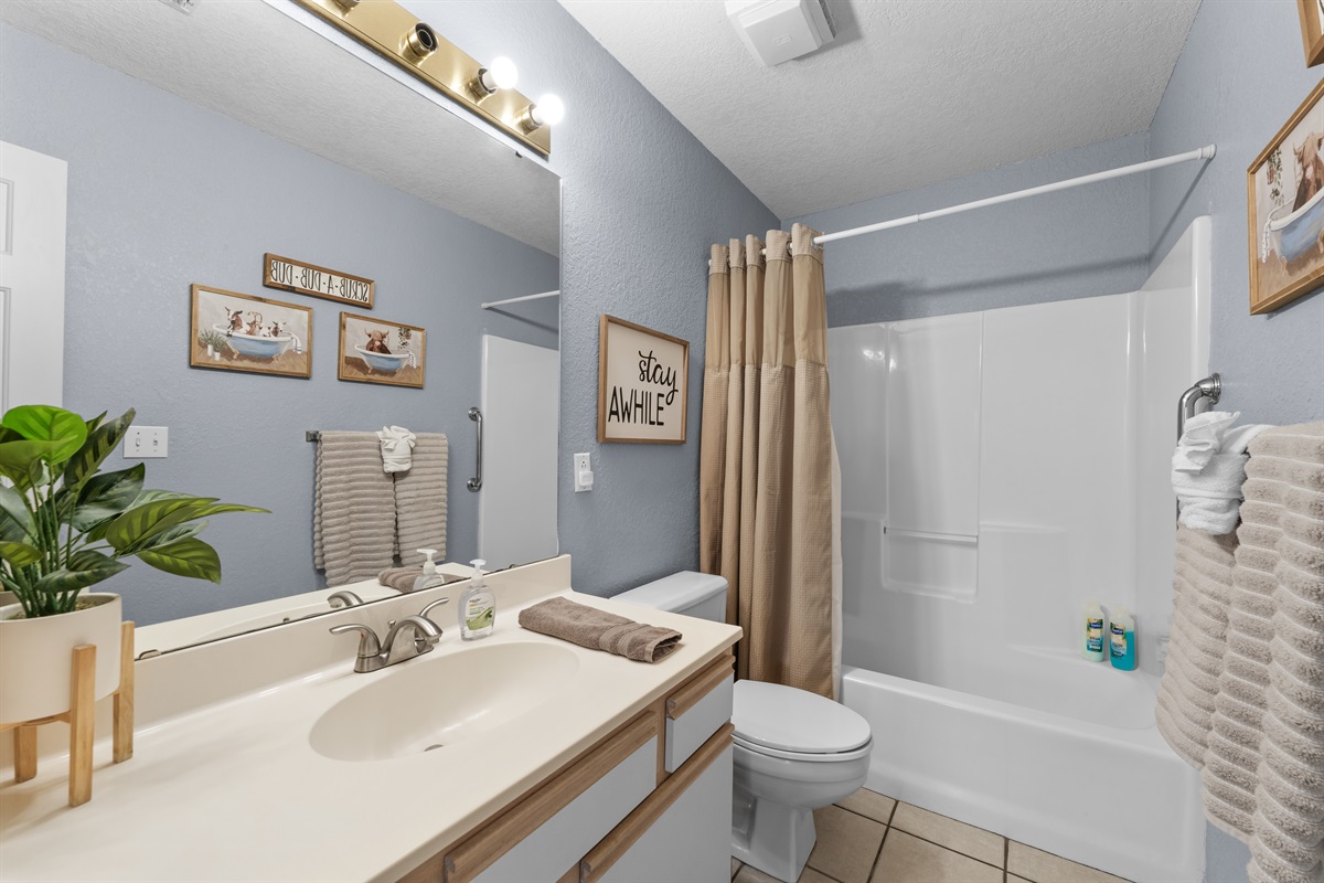 A spacious primary bathroom adds convenience without the usual crowding.