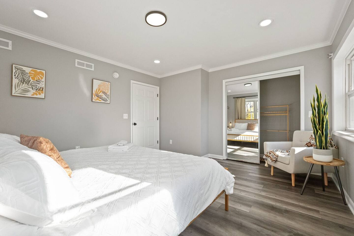 Scenic view from the bedroom, complemented by a large mirror on the closet, adding depth and light to the space.