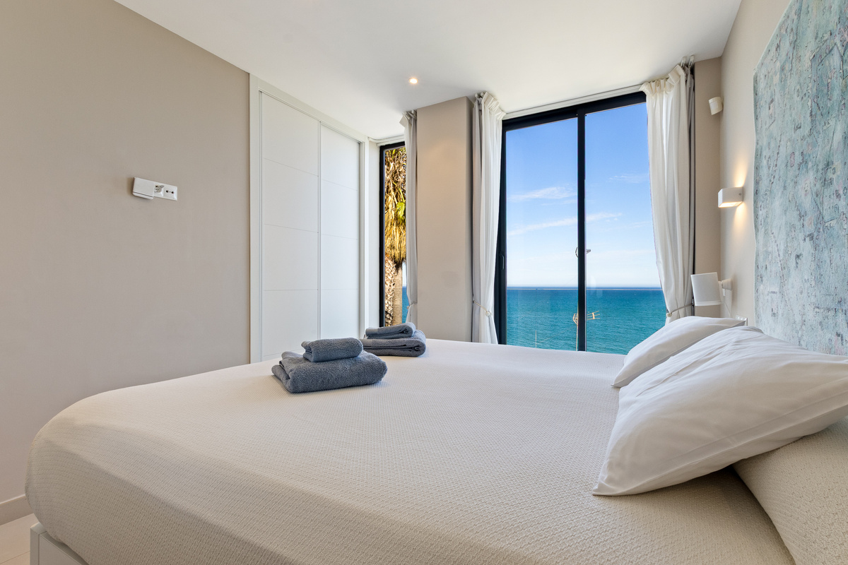 Bedroom with sea-facing window and built-in wardrobe