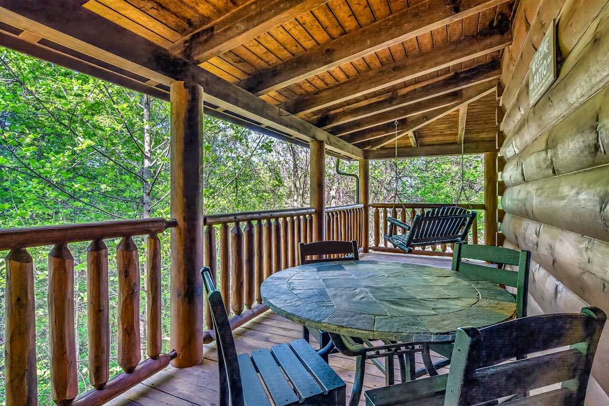 Side porch includes an outdoor dining area.  