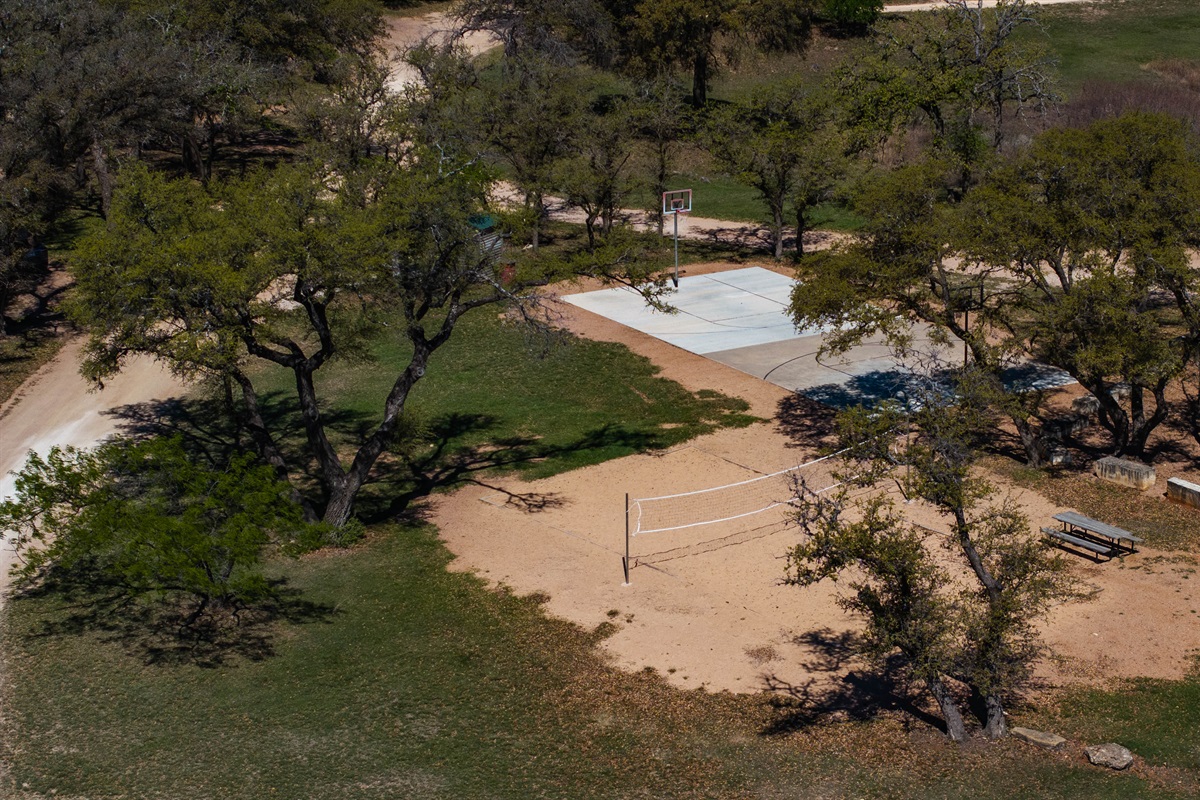 Point Venture Park offers a basketball court and a sand volleyball court.